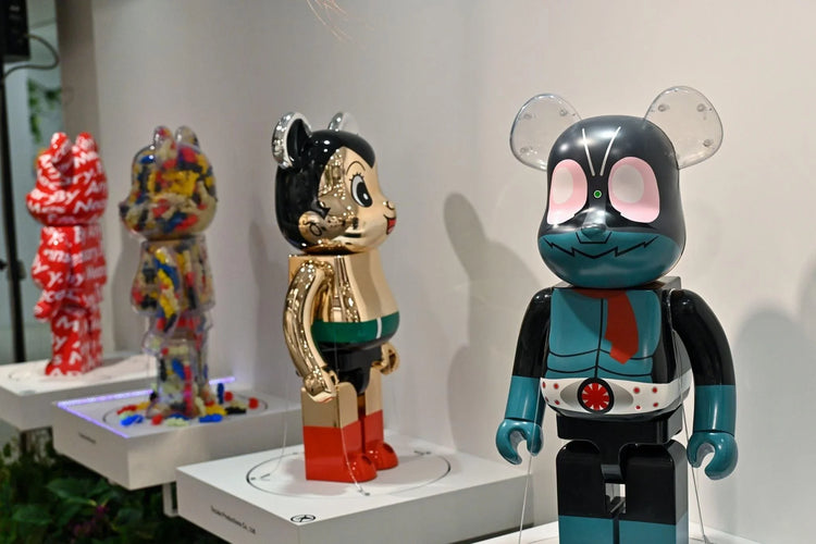 PopArtFusion display of four unique Be@rbrick designer collectible figures with colorful and reflective finishes